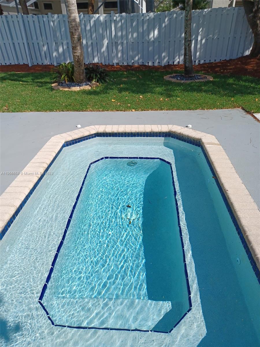 680 Falling Water Road Weston, FL 33326 - Photo 9 of 37 a view of a yard