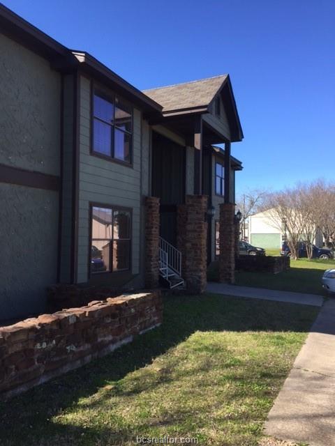 4400 Boyett Street, Unit B Bryan, TX 77801 - Photo 11 of 11 a front view of a house with a yard