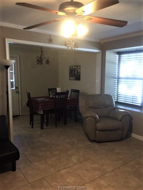 4400 Boyett Street, Unit B Bryan, TX 77801 - Photo 6 of 11 a living room with furniture and a window