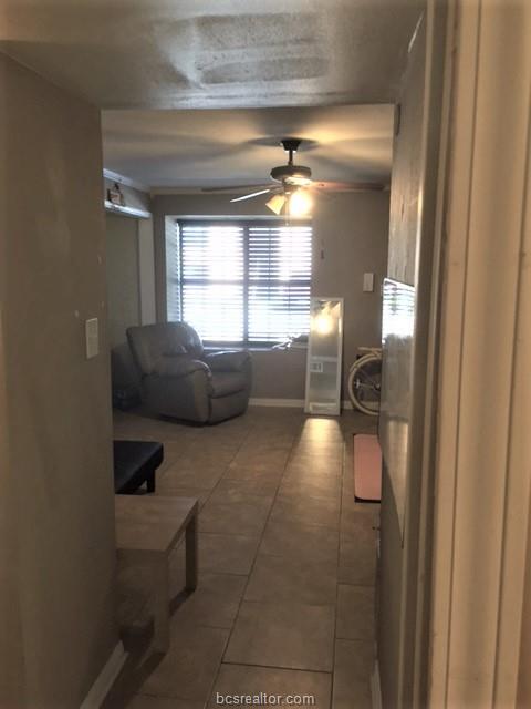 4400 Boyett Street, Unit B Bryan, TX 77801 - Photo 8 of 11 a living room with furniture and a window