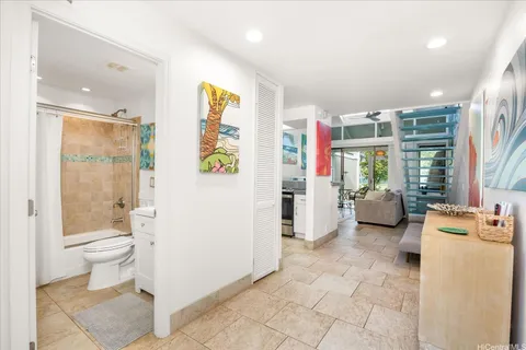 a bathroom with a toilet sink and shower