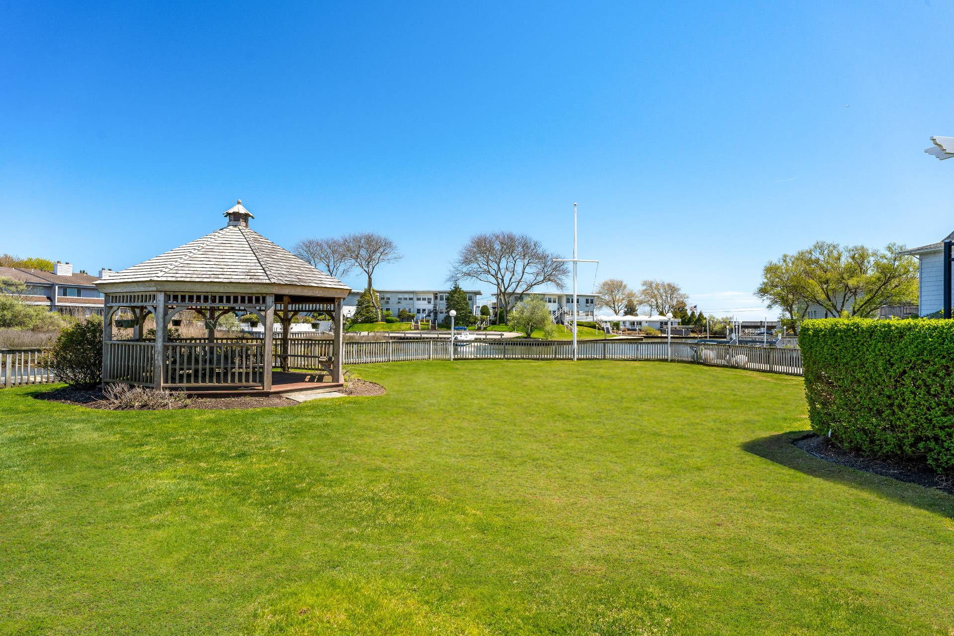 3012 Mitchell Road Westhampton Beach, NY 11978 - Photo 21 of 25 a front view of a house with swimming pool having outdoor seating