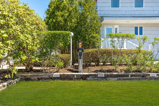 a view of swimming pool with outdoor seating and trees