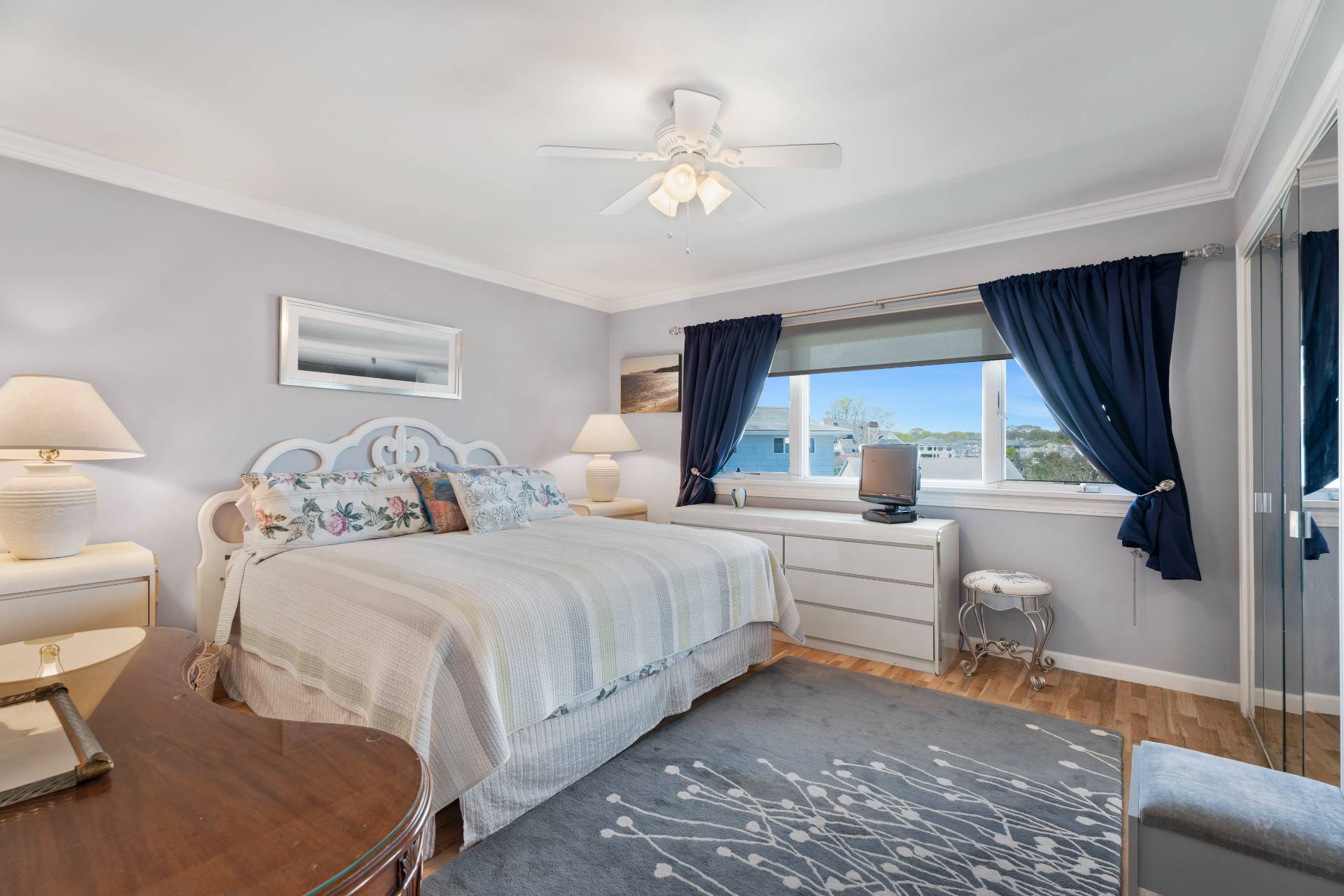 3012 Mitchell Road Westhampton Beach, NY 11978 - Photo 7 of 25 a bedroom with a large bed and a window