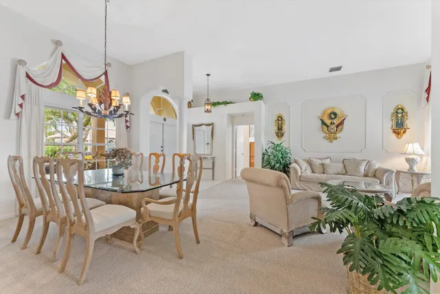 a bathroom with a sink a toilet and a large mirror