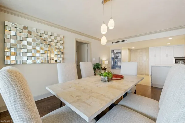 a living room with kitchen island furniture and a table