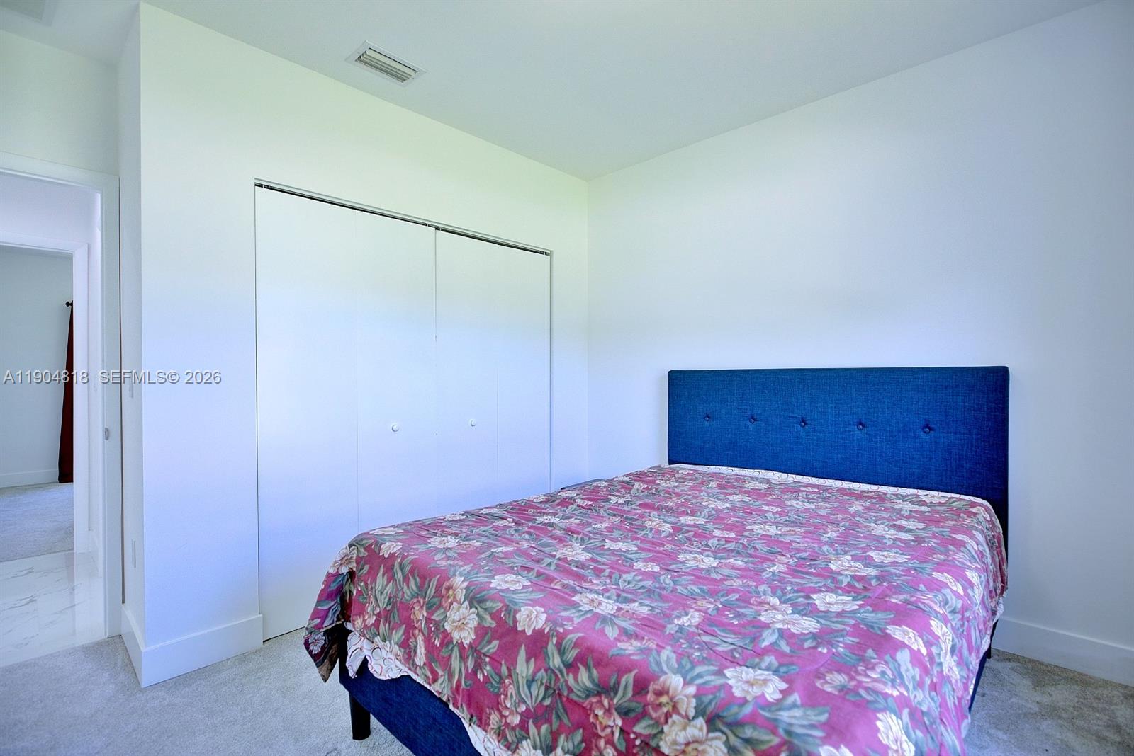 827 Renault Avenue Sebring, FL 33872 - Photo 15 of 27 a bedroom with a bed and a dresser