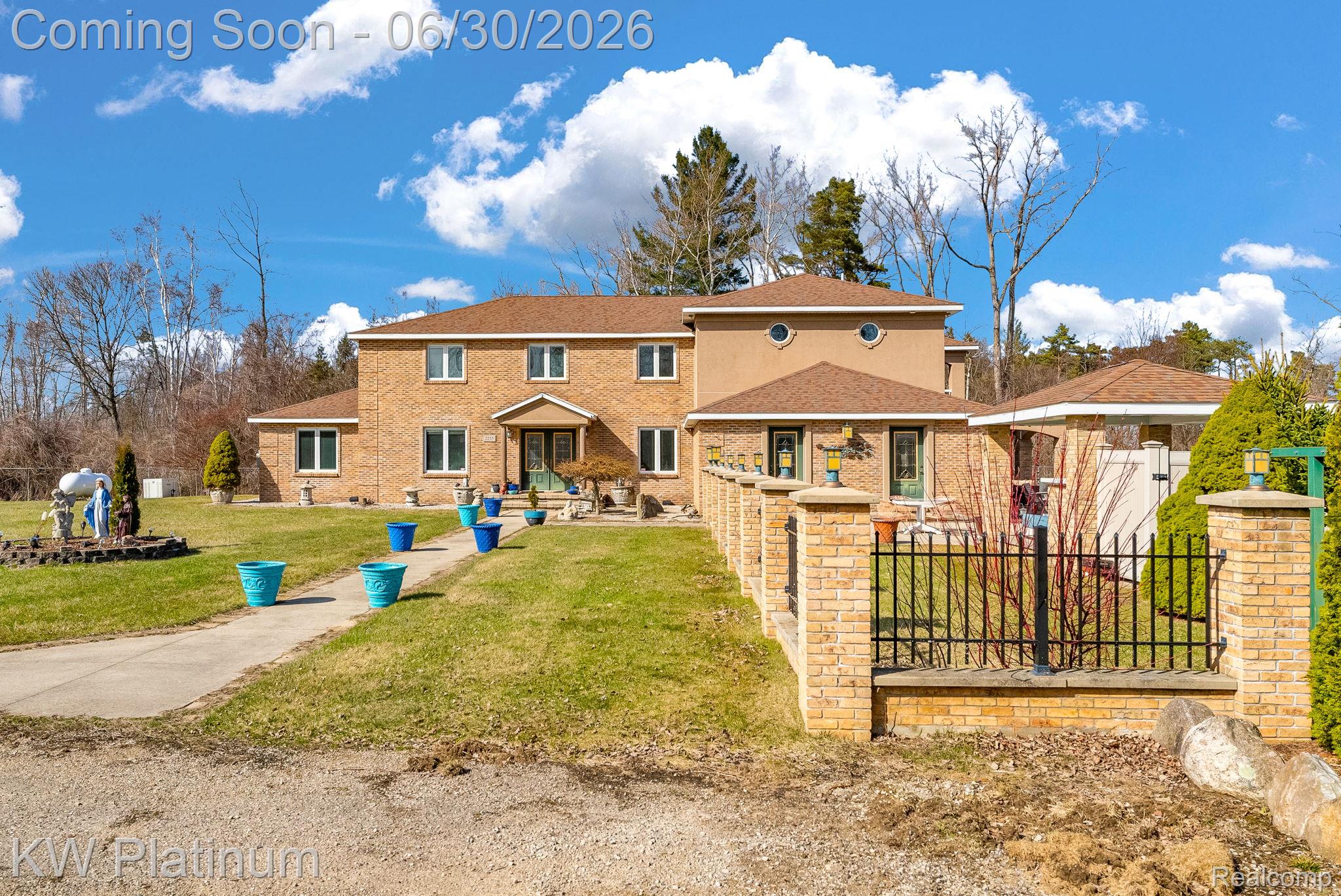 2235 South Lake Shore Road Harbor Beach, MI 48441 - Photo 88 of 99 Brick and stucco exterior with multiple windows and a prominent entry