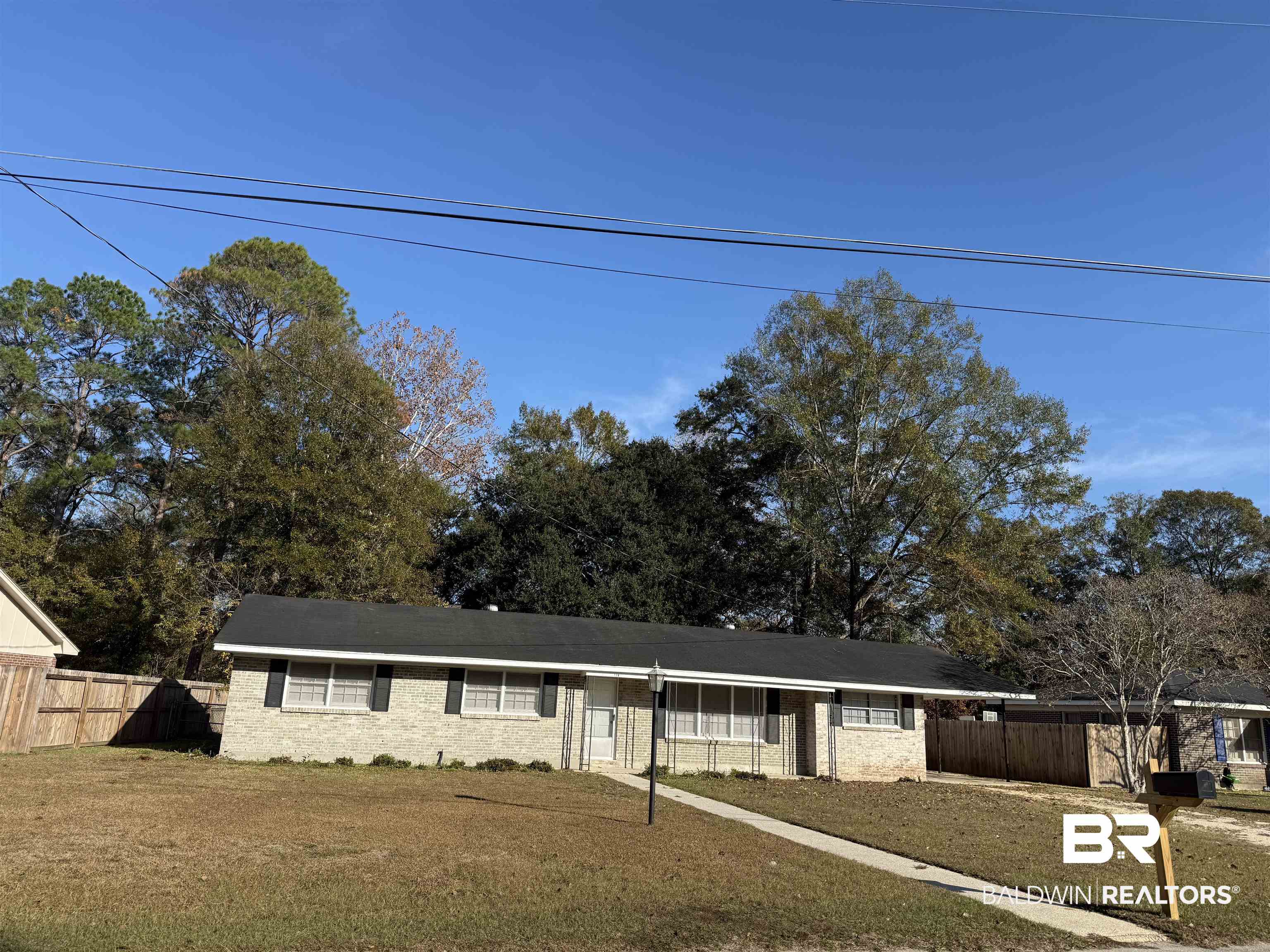 114 Spruce Avenue Brewton, AL 36426 - Photo 1 of 13 Single story home featuring brick siding and a carport