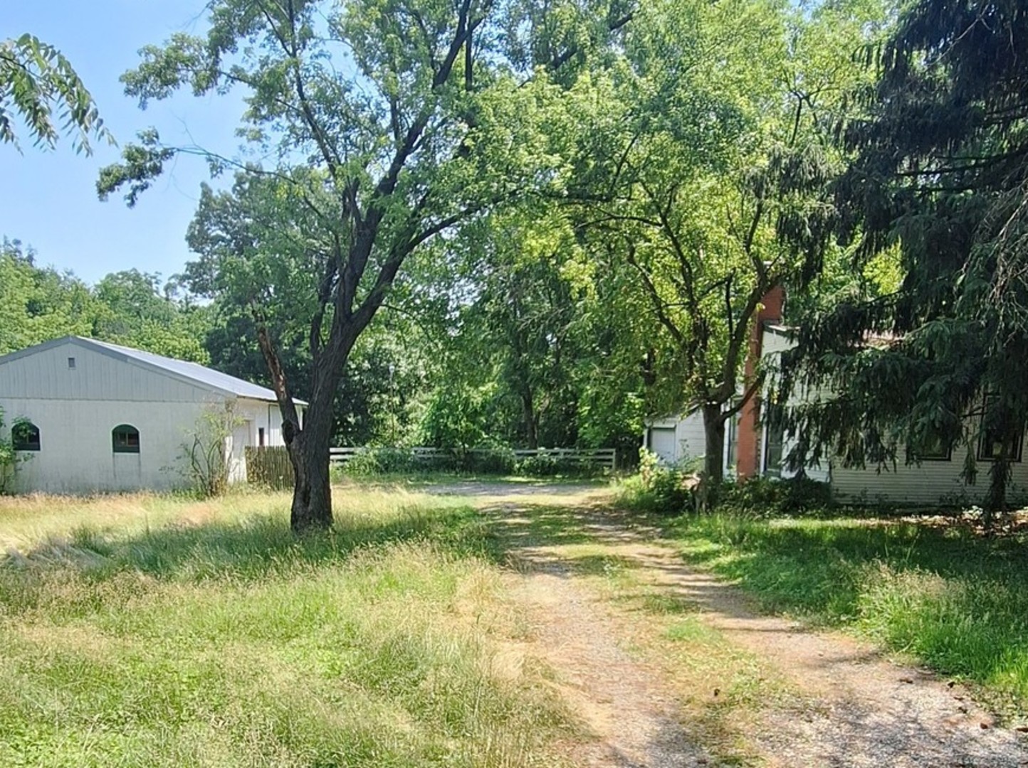 6704 South Rawson Bridge Road Cary, IL 60013 - Photo 1 of 10 a backyard of a house with swimming pool and green space