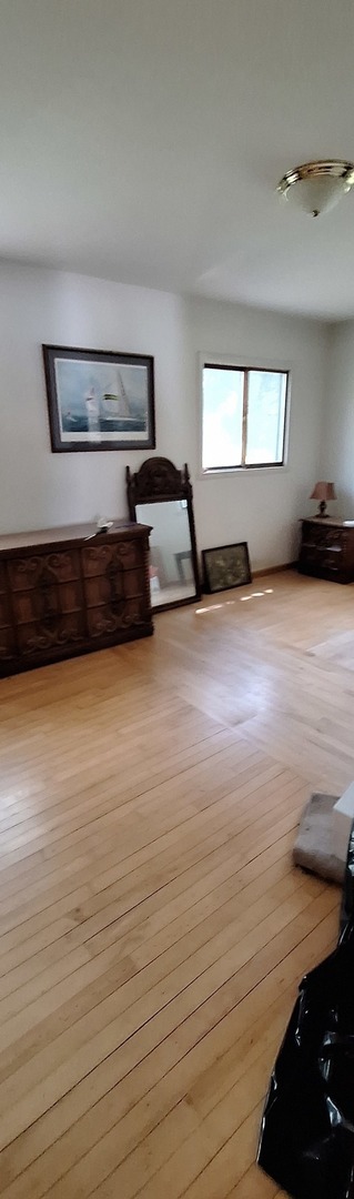 6704 South Rawson Bridge Road Cary, IL 60013 - Photo 8 of 10 a view of a room with wooden floor