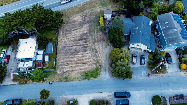 an aerial view of a house with outdoor space