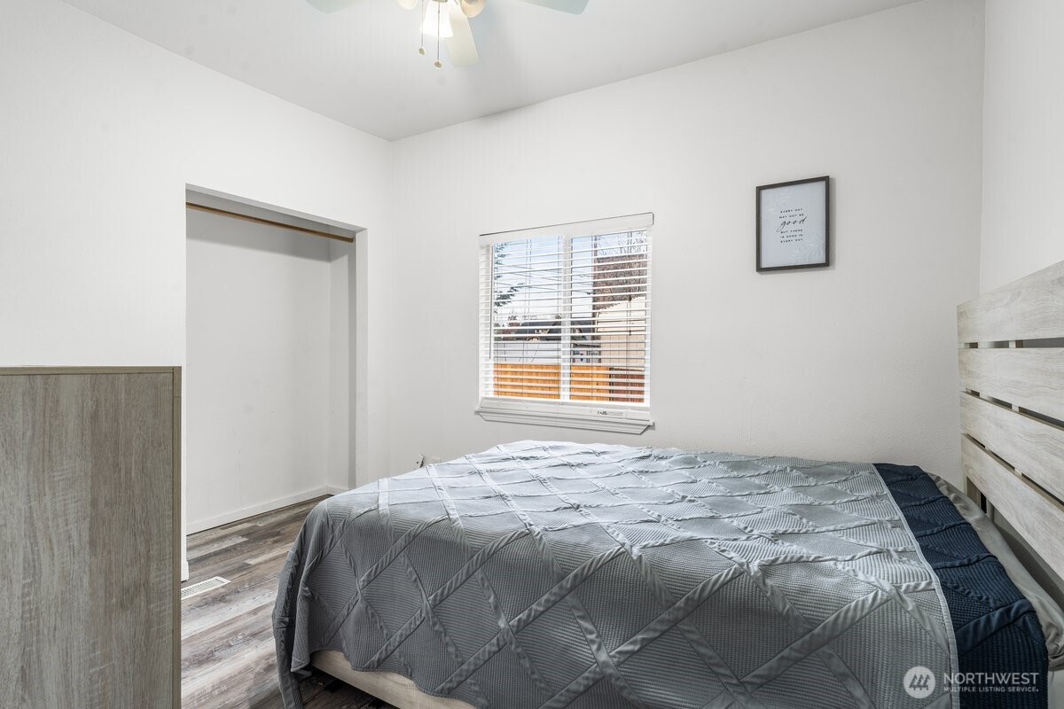 1916 Martin Luther King Junior Way Tacoma, WA 98405 - Photo 13 of 17 a bedroom with a bed and a window