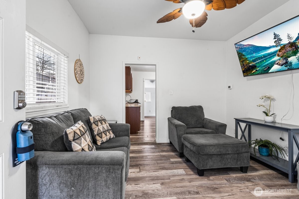 1916 Martin Luther King Junior Way Tacoma, WA 98405 - Photo 4 of 17 a living room with furniture and a flat screen tv