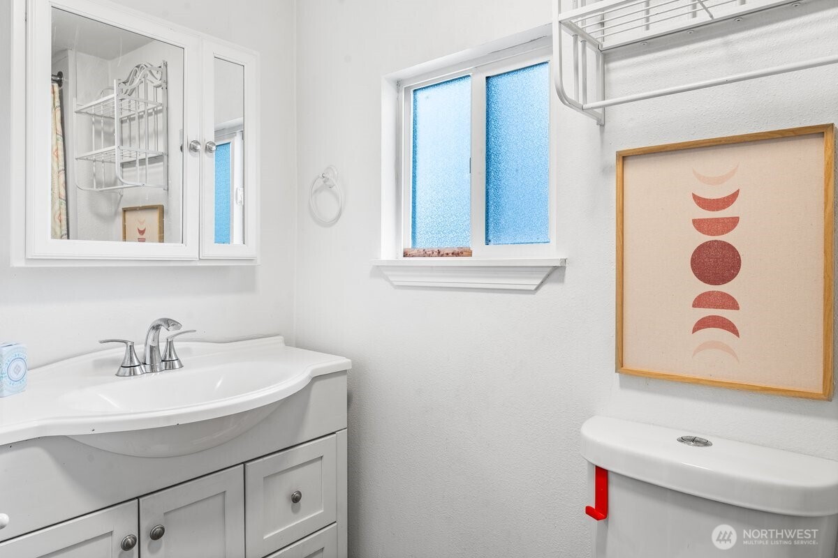 1916 Martin Luther King Junior Way Tacoma, WA 98405 - Photo 8 of 17 a bathroom with a sink and a mirror