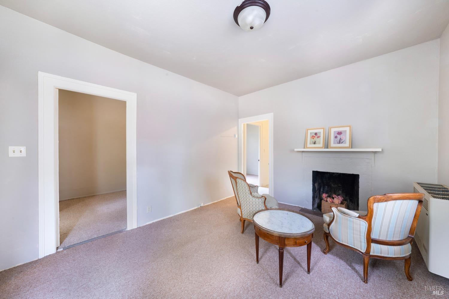 1664 Spring Street St. Helena, CA 94574 - Photo 11 of 27 a room with furniture and a fireplace