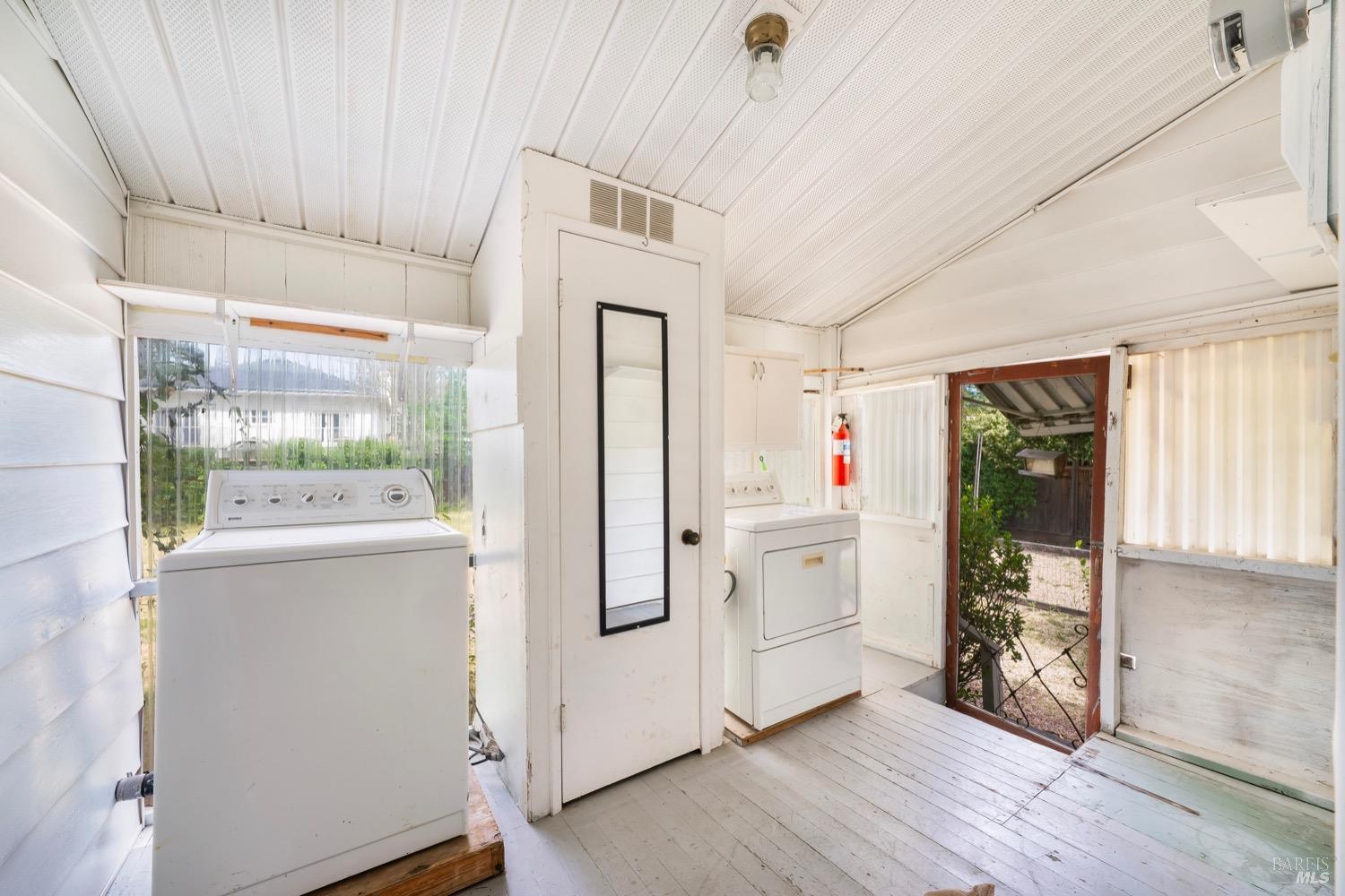 1664 Spring Street St. Helena, CA 94574 - Photo 18 of 27 a kitchen with white cabinets and white appliances