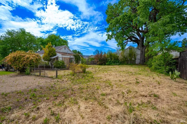 a view of a yard with an outdoor space