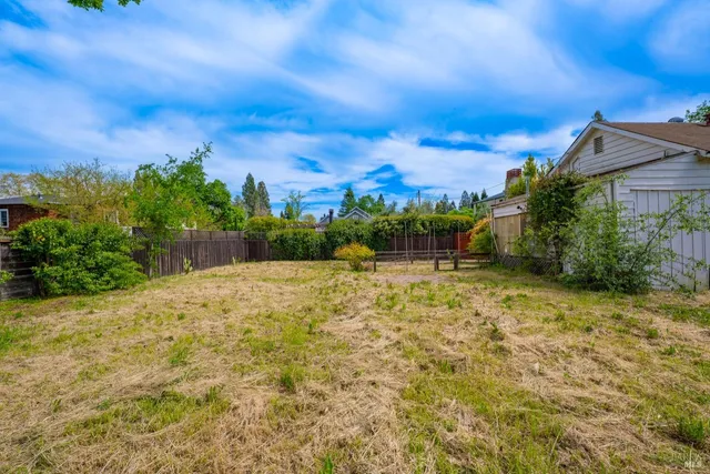 a backyard of a house with lots of green space