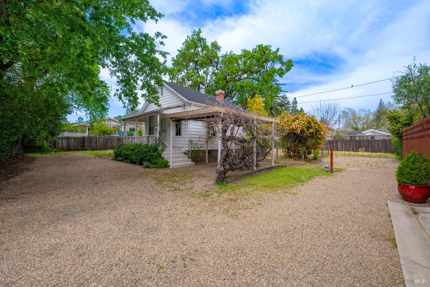 1664 Spring Street St. Helena, CA 94574 - Photo 5 of 27 a view of a house with a yard and potted plants