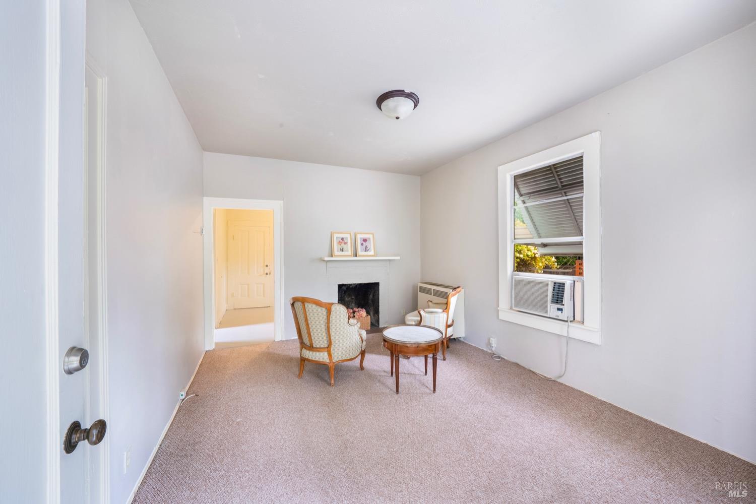 1664 Spring Street St. Helena, CA 94574 - Photo 9 of 27 a living room with furniture and a window