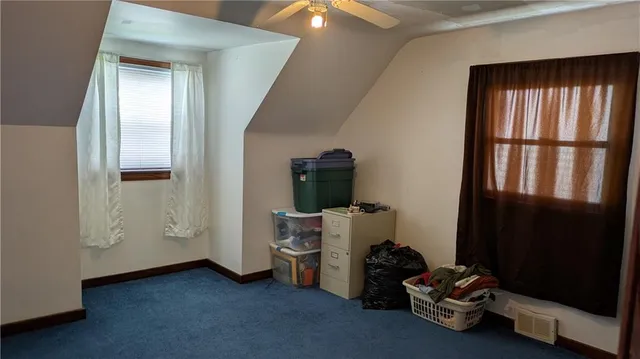 a room with a window and a mirror