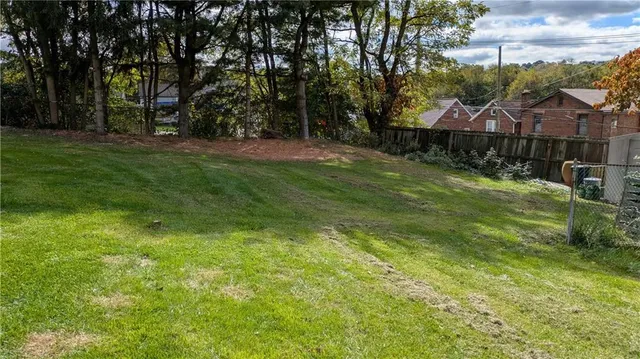 a view of a house with a big yard