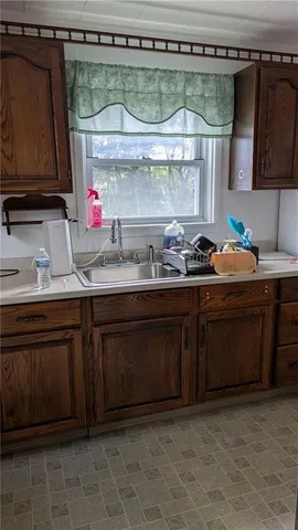 a kitchen with a sink and a stove