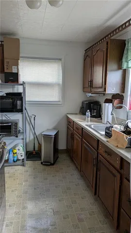 a kitchen with cabinets and appliances