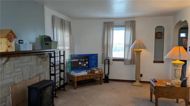 a bedroom with furniture and a window