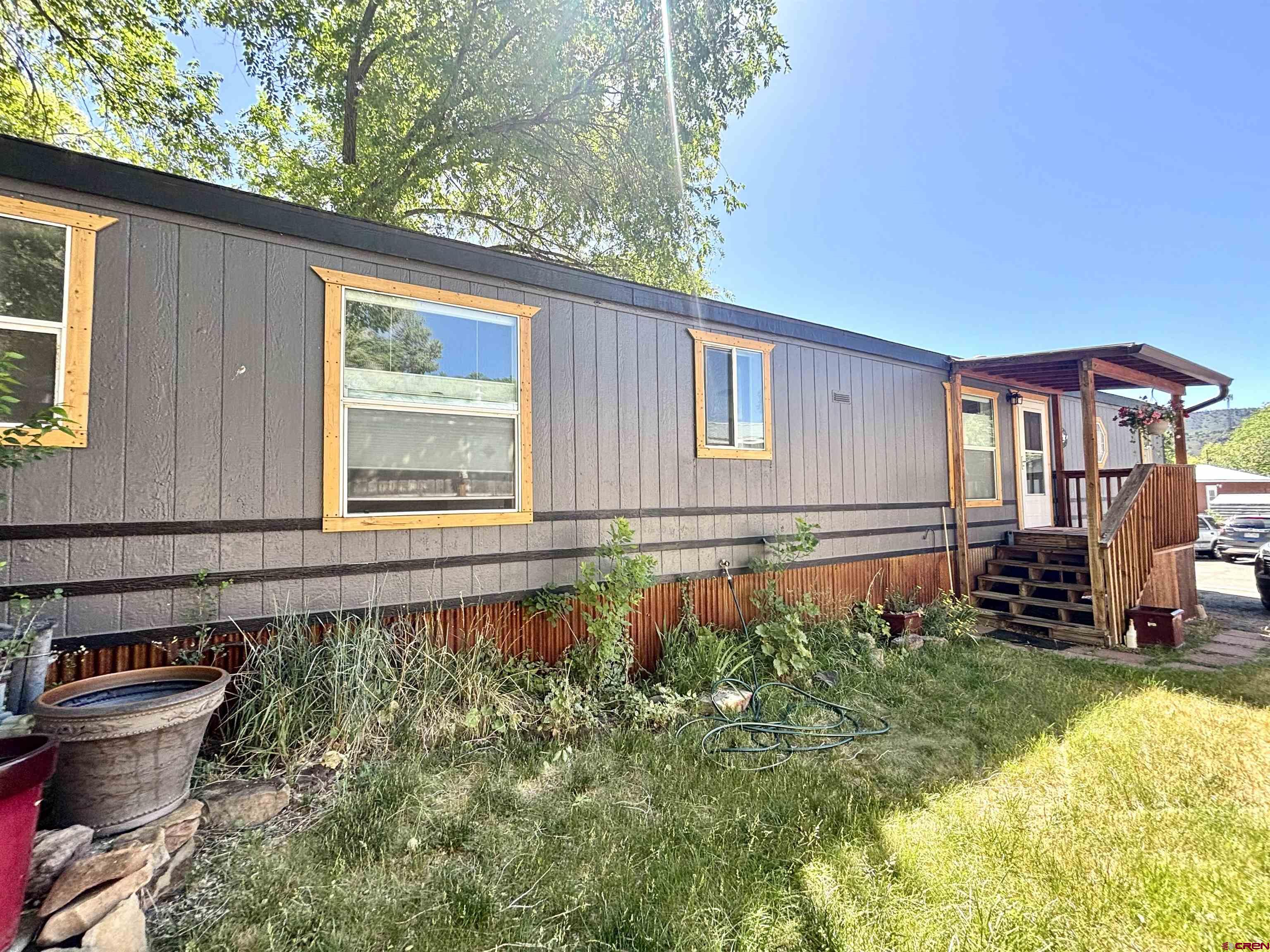 288 Animas View Drive, Unit 9 Durango, CO 81301 - Photo 4 of 16 a front view of a house with a yard
