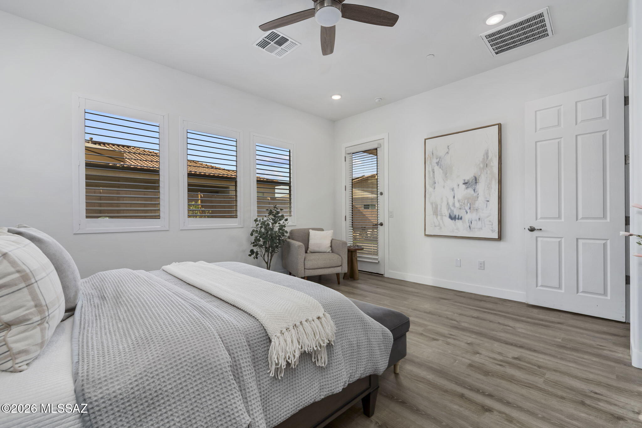 12791 East Tortoise Pointe Drive Vail, AZ 85641 - Photo 25 of 50 a spacious bedroom with a large bed and a window