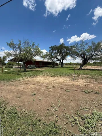 a view of a lake with a big yard