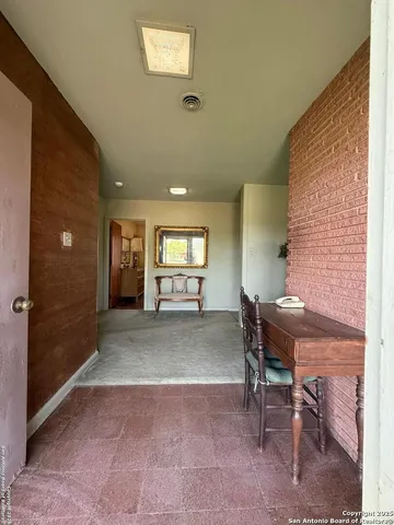 a view of a livingroom with furniture and windows