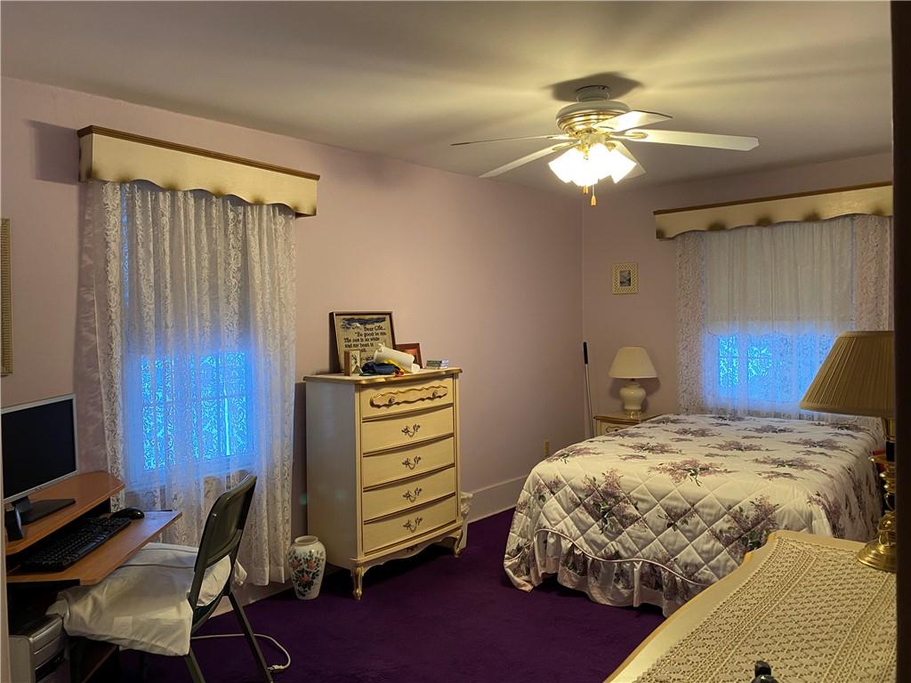 2300 Cottage Avenue Natrona Heights, PA 15065 - Photo 9 of 15 a bedroom with a bed and a chandelier