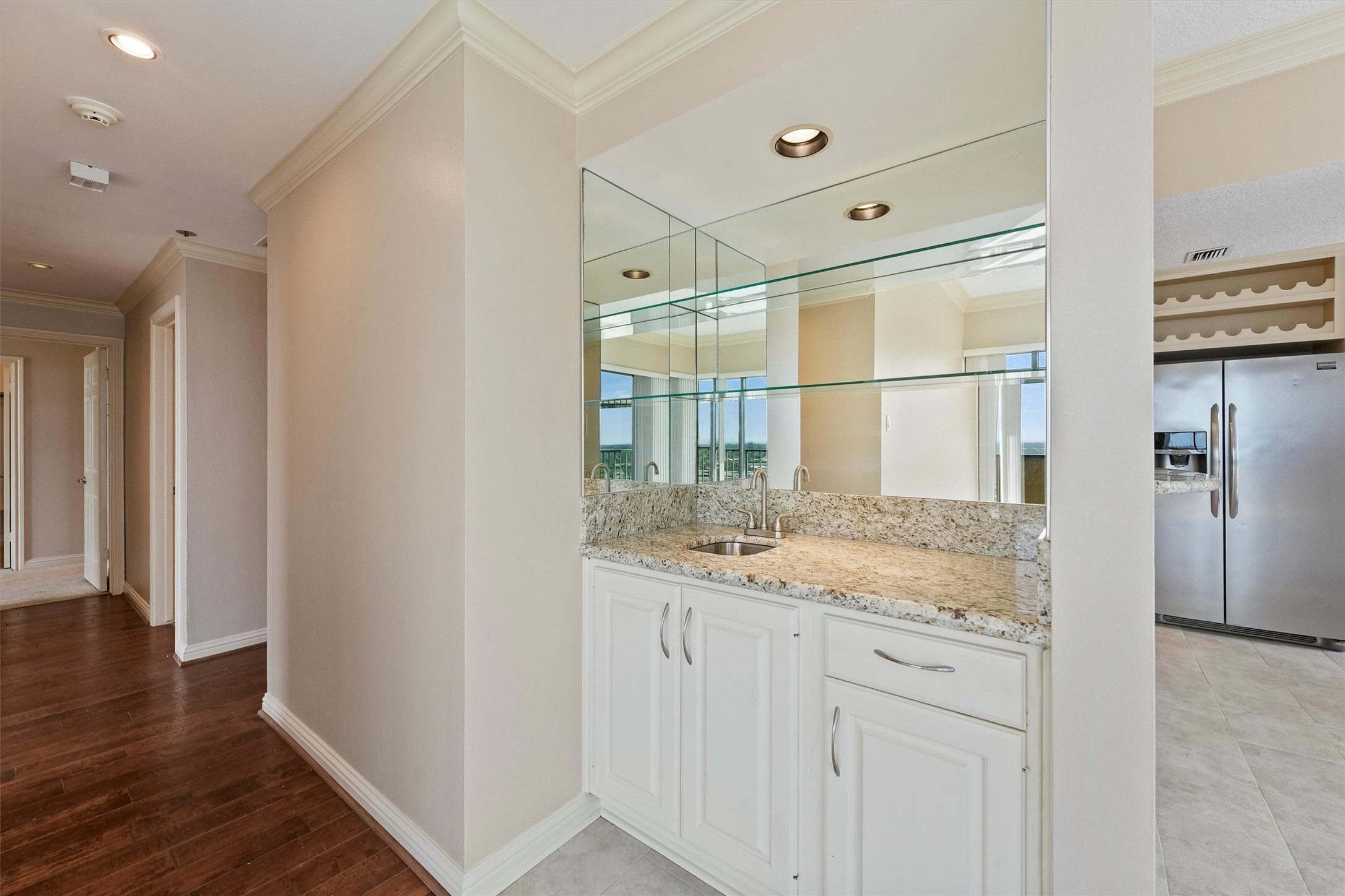 3350 McCue Road, Unit 2301 Houston, TX 77056 - Photo 15 of 31 a bathroom with a granite countertop sink and a mirror