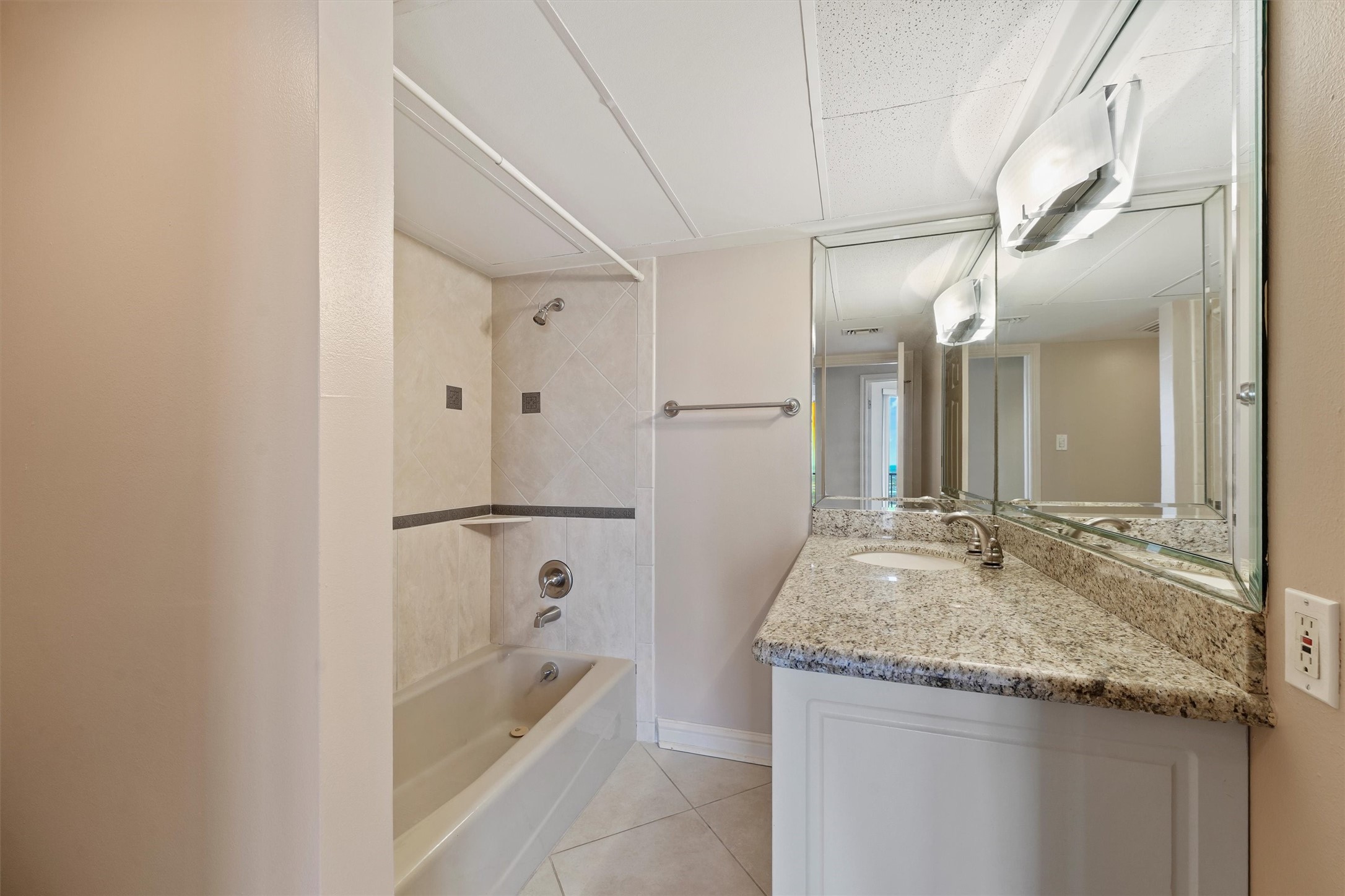 3350 McCue Road, Unit 2301 Houston, TX 77056 - Photo 18 of 31 a bathroom with a granite countertop sink and a mirror