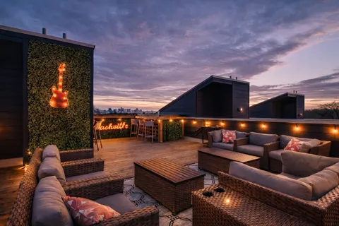a outdoor living space with patio furniture and a potted plant