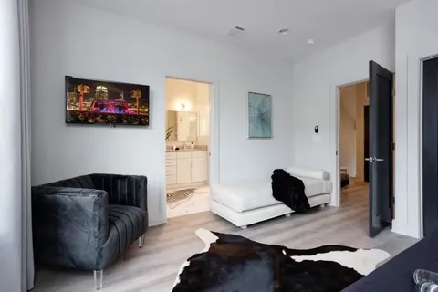a bathroom with double sink and a mirror