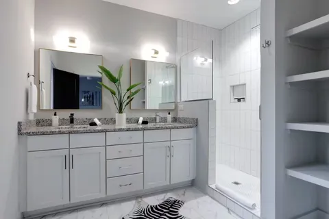a bathroom with a sink a vanity and a mirror