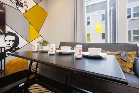 a kitchen with kitchen island granite countertop lots of counter top space and dining table