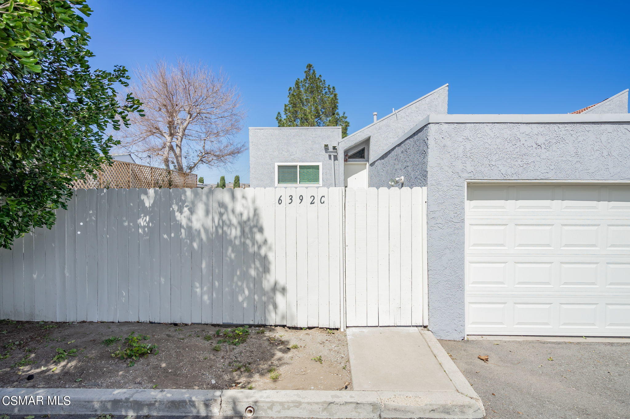 6392 Katherine Road, Unit C Simi Valley, CA 93063 - Photo 3 of 31 a view of a house with a small yard