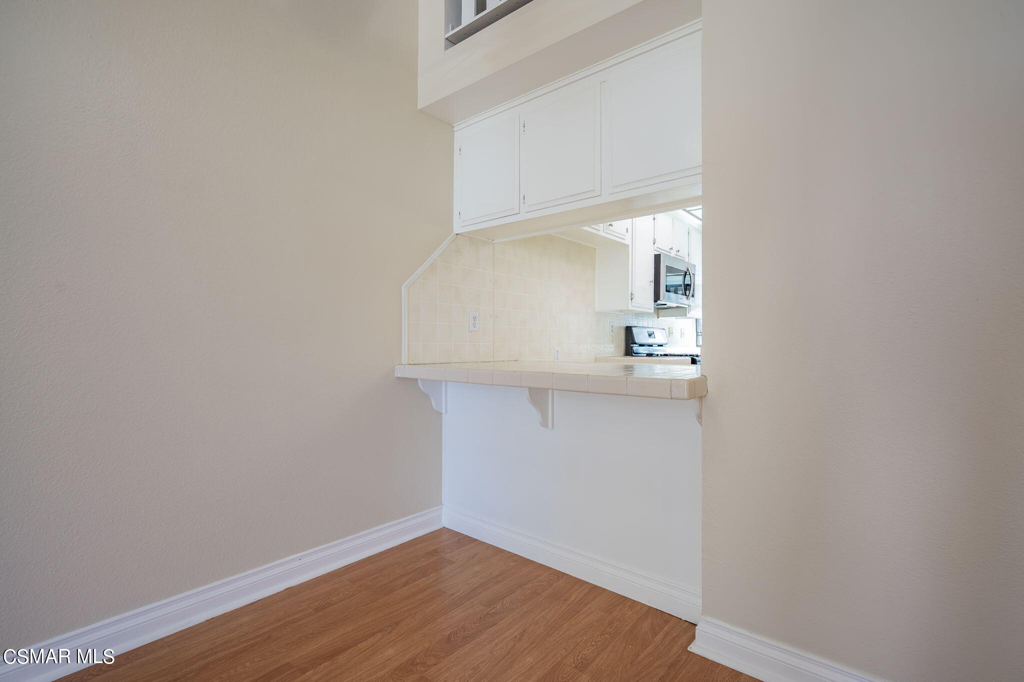 6392 Katherine Road, Unit C Simi Valley, CA 93063 - Photo 24 of 31 a view of a hallway with wooden floor