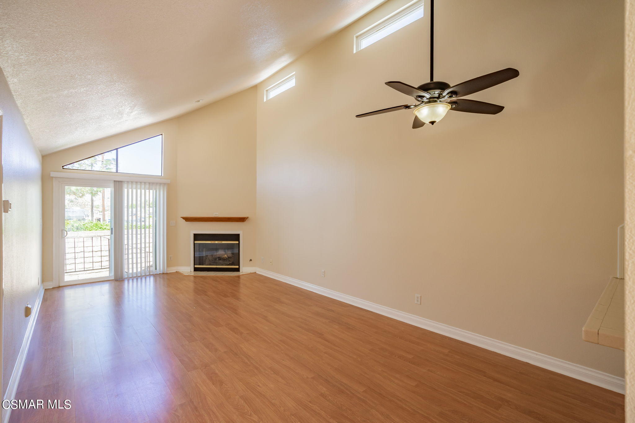 6392 Katherine Road, Unit C Simi Valley, CA 93063 - Photo 6 of 31 an empty room with wooden floor fan and windows