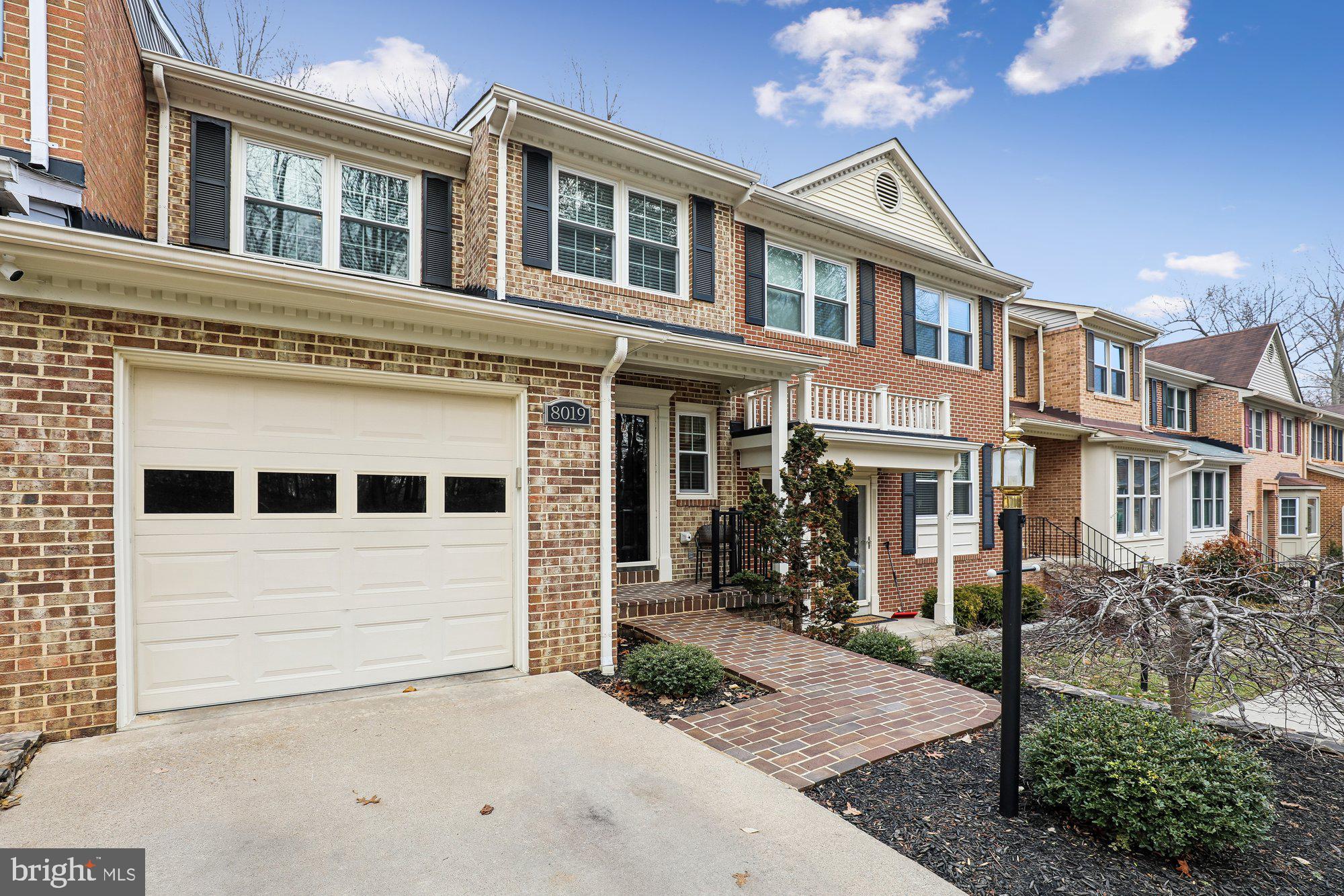 8019 Galla Knoll Circle Springfield, VA 22153 - Photo 2 of 57 a front view of a house with a yard