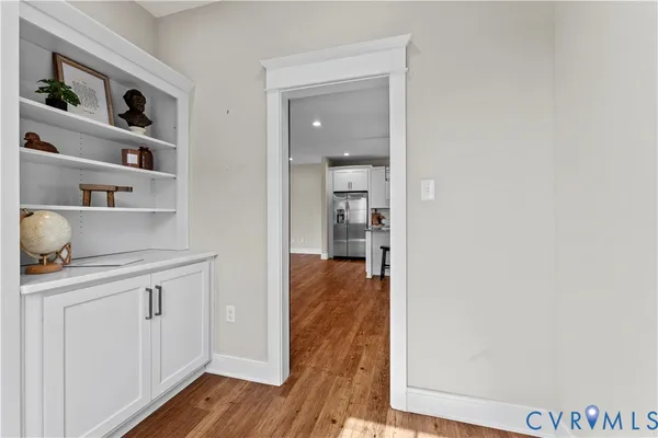 a view of room with window and hardwood floor