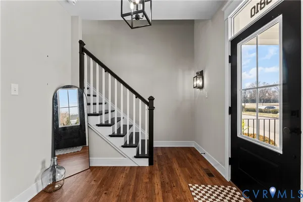a view of a kitchen with a refrigerator and a floor to ceiling window