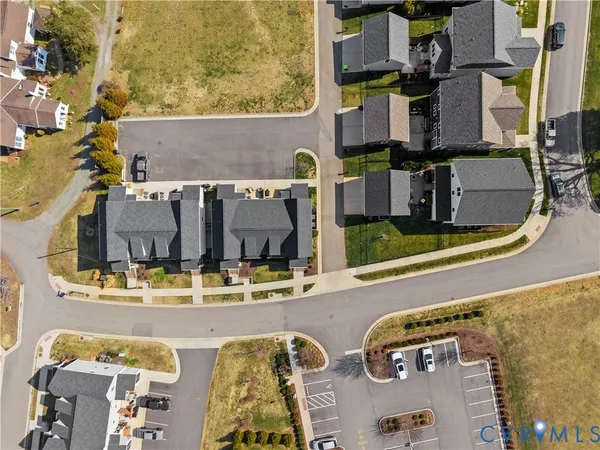 an aerial view of a house with a ocean view