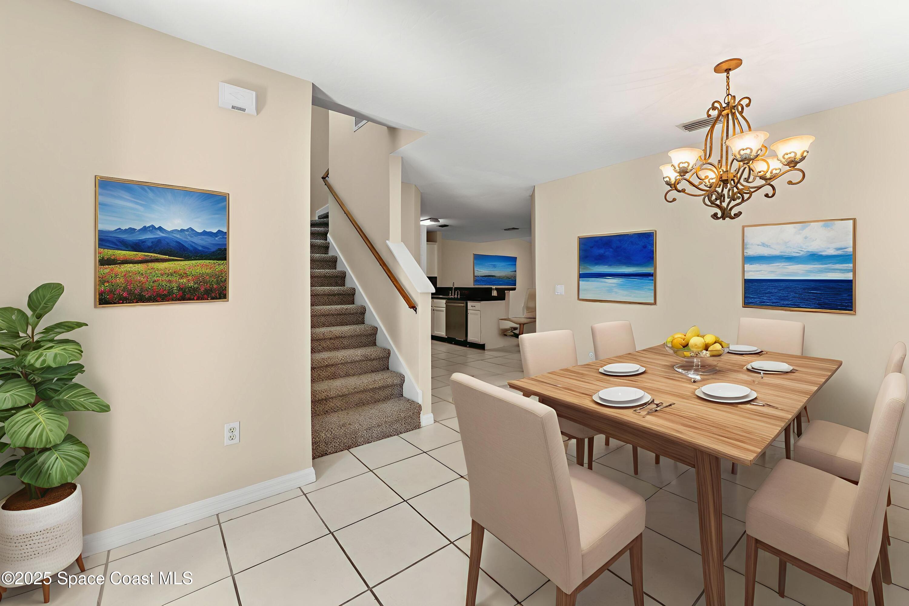 36 Sunset Street Satellite Beach, FL 32937 - Photo 11 of 45 a view of a dining room with furniture and wooden floor