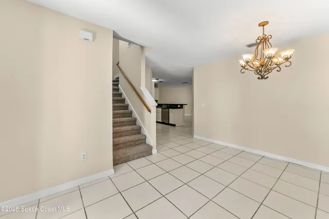 a view of a livingroom with stairs